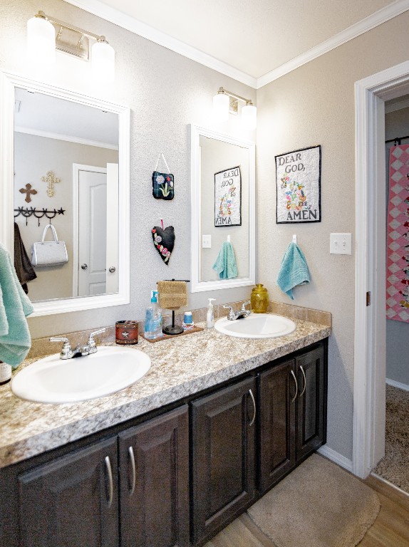 1891 Dworaczyk Road Yorktown, TX 78164 - Photo 45 of 48 a bathroom with a granite countertop double vanity sinks and a mirror