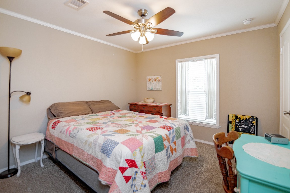 1891 Dworaczyk Road Yorktown, TX 78164 - Photo 47 of 48 a bedroom with bed and window