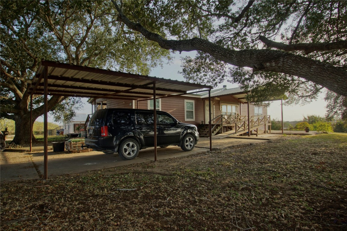 1891 Dworaczyk Road Yorktown, TX 78164 - Photo 10 of 48 a view of parking garage with a car parked in it