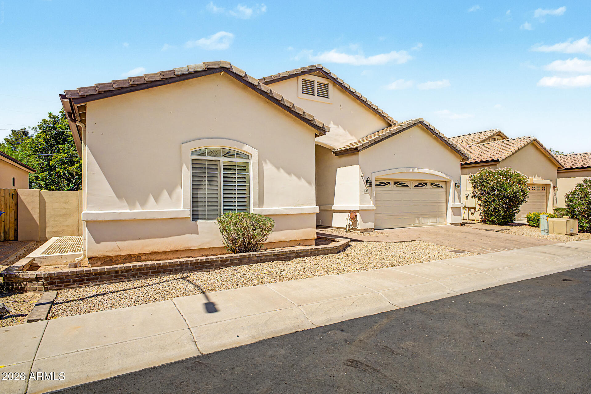 808 West Citrus Way Phoenix, AZ 85013 - Photo 3 of 35 a front view of a house with a yard and garage