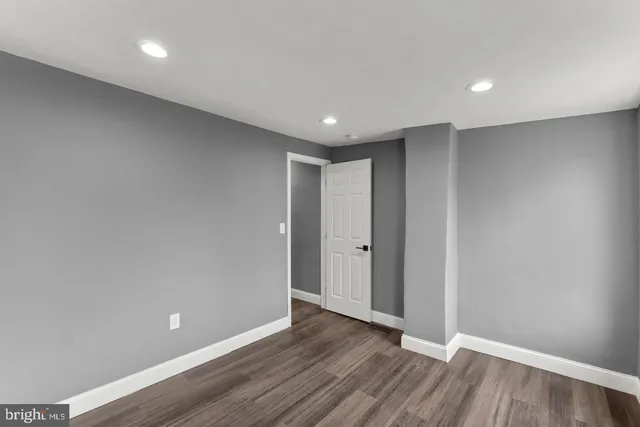 a view of hallway with wooden floor