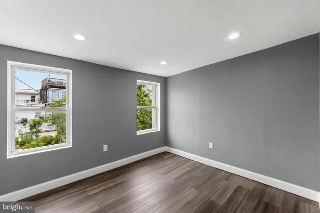 an empty room with windows