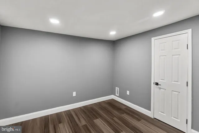 a view of room with wooden floor