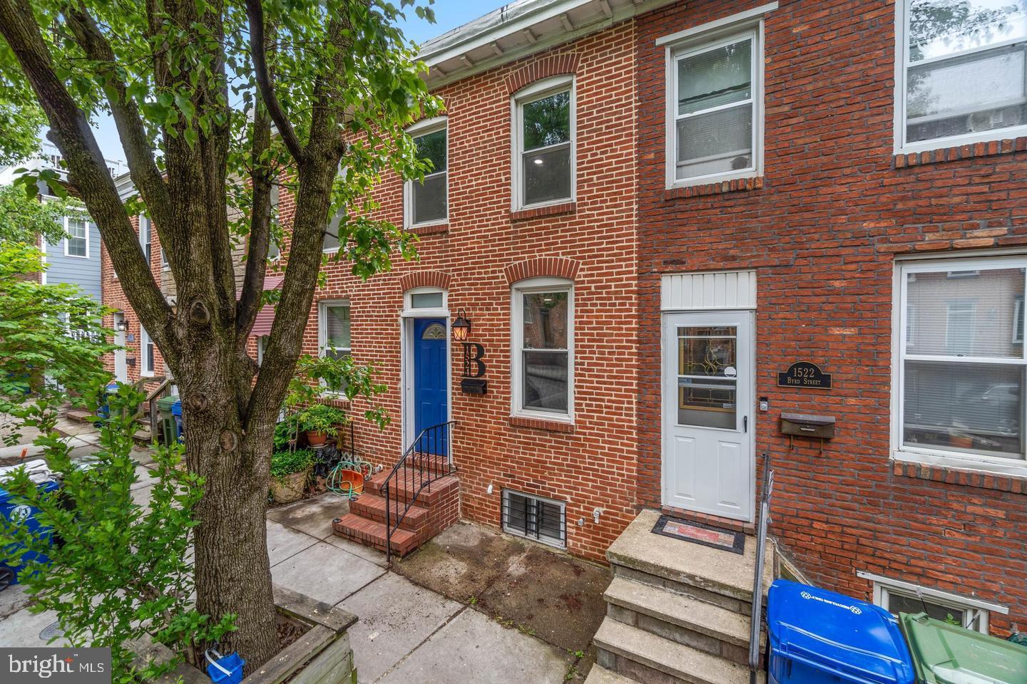 1524 Byrd Street Baltimore, MD 21230 - Photo 2 of 26 a front view of a house with a garden