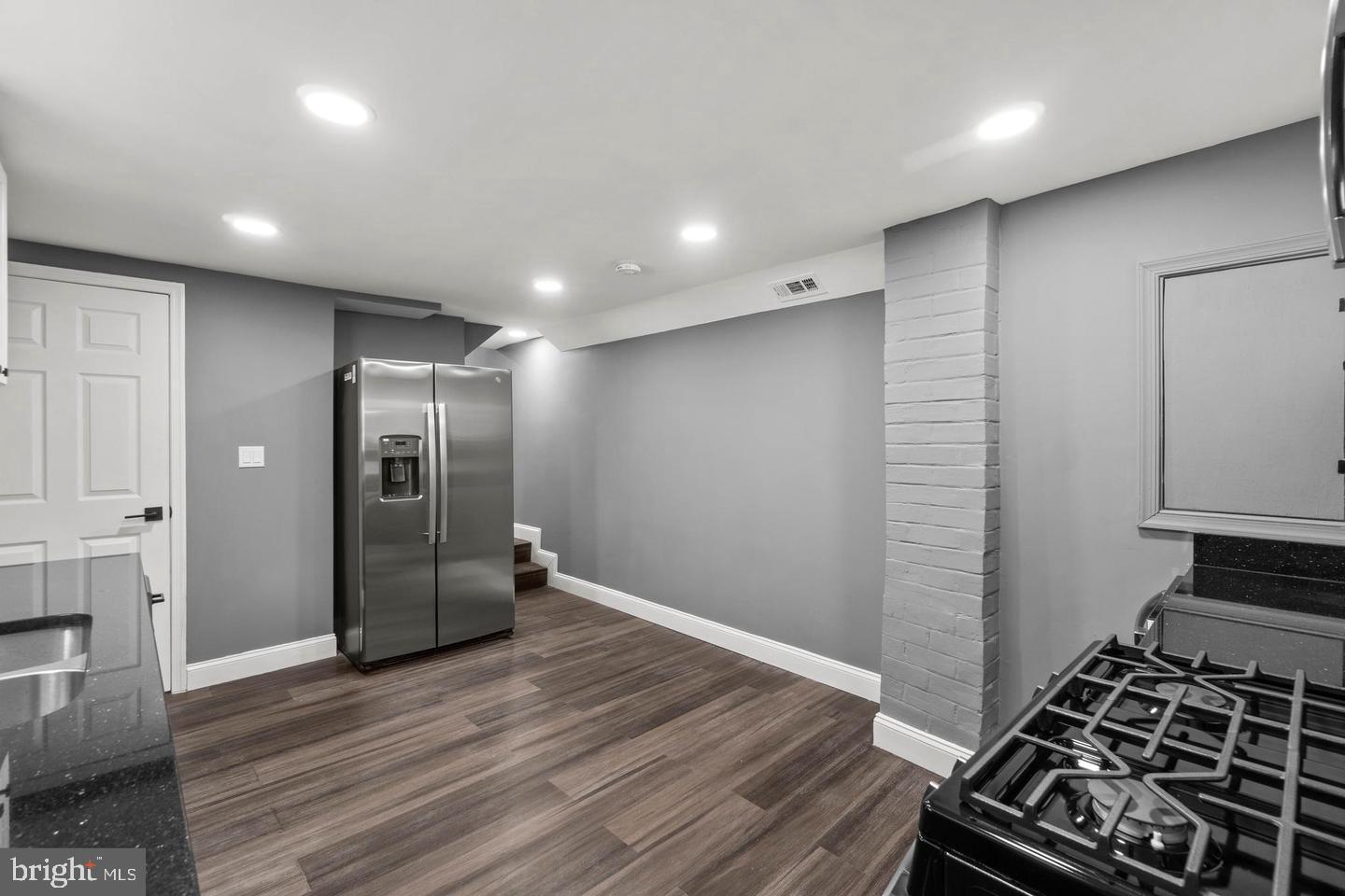 1524 Byrd Street Baltimore, MD 21230 - Photo 10 of 26 a kitchen with stainless steel appliances a refrigerator and a stove top oven