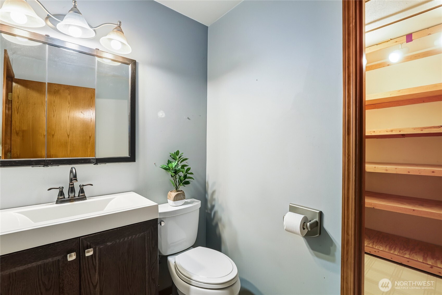 15121 Cedar Grove Road Northeast Poulsbo, WA 98370 - Photo 19 of 40 a bathroom with a sink vanity mirror and toilet