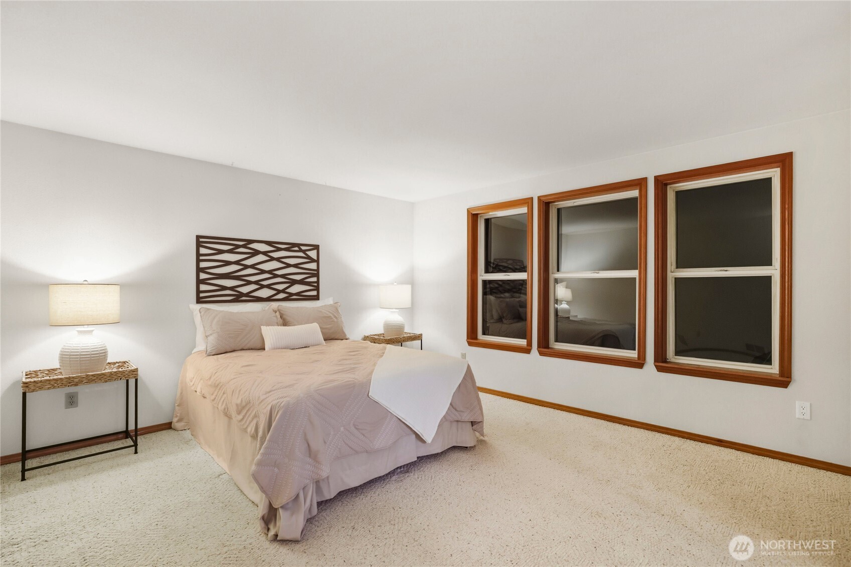 15121 Cedar Grove Road Northeast Poulsbo, WA 98370 - Photo 20 of 40 a bedroom with a bed and a large window