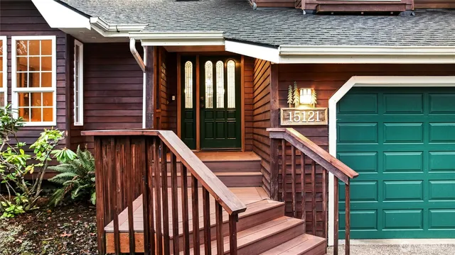 a view of balcony with small yard