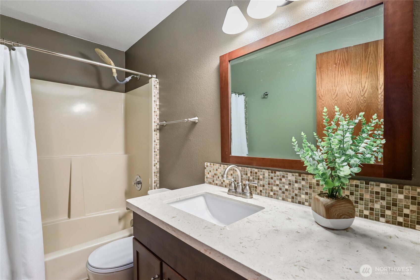 15121 Cedar Grove Road Northeast Poulsbo, WA 98370 - Photo 30 of 40 a bathroom with a sink and a mirror