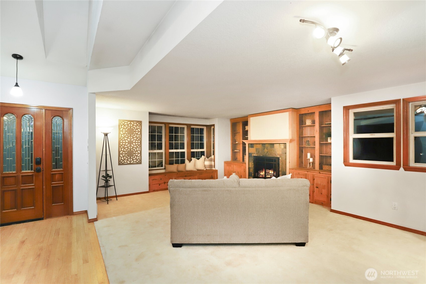 15121 Cedar Grove Road Northeast Poulsbo, WA 98370 - Photo 3 of 40 a living room with furniture and large windows