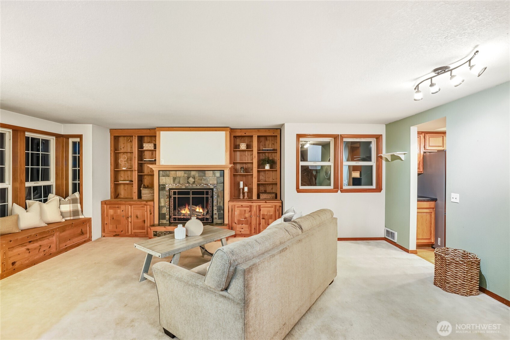 15121 Cedar Grove Road Northeast Poulsbo, WA 98370 - Photo 4 of 40 a living room with furniture window and a fireplace