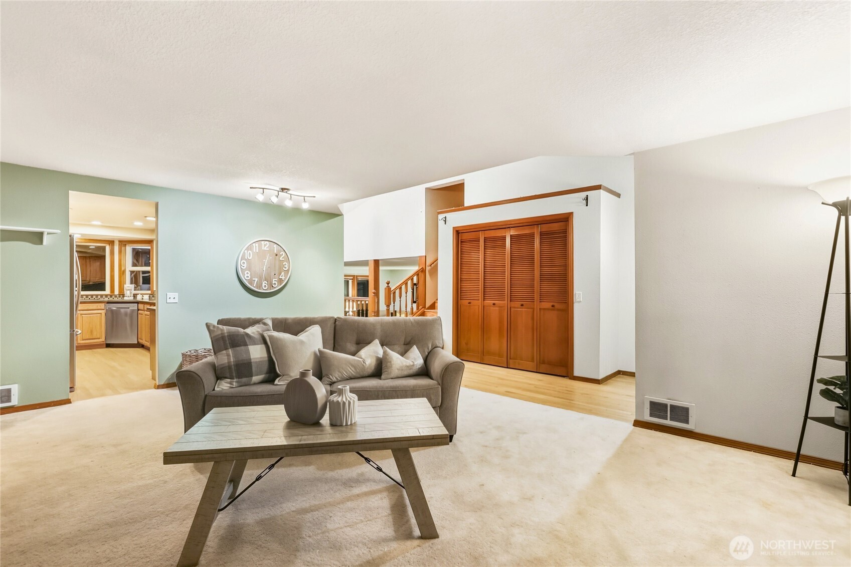 15121 Cedar Grove Road Northeast Poulsbo, WA 98370 - Photo 5 of 40 a living room with furniture and wooden floor