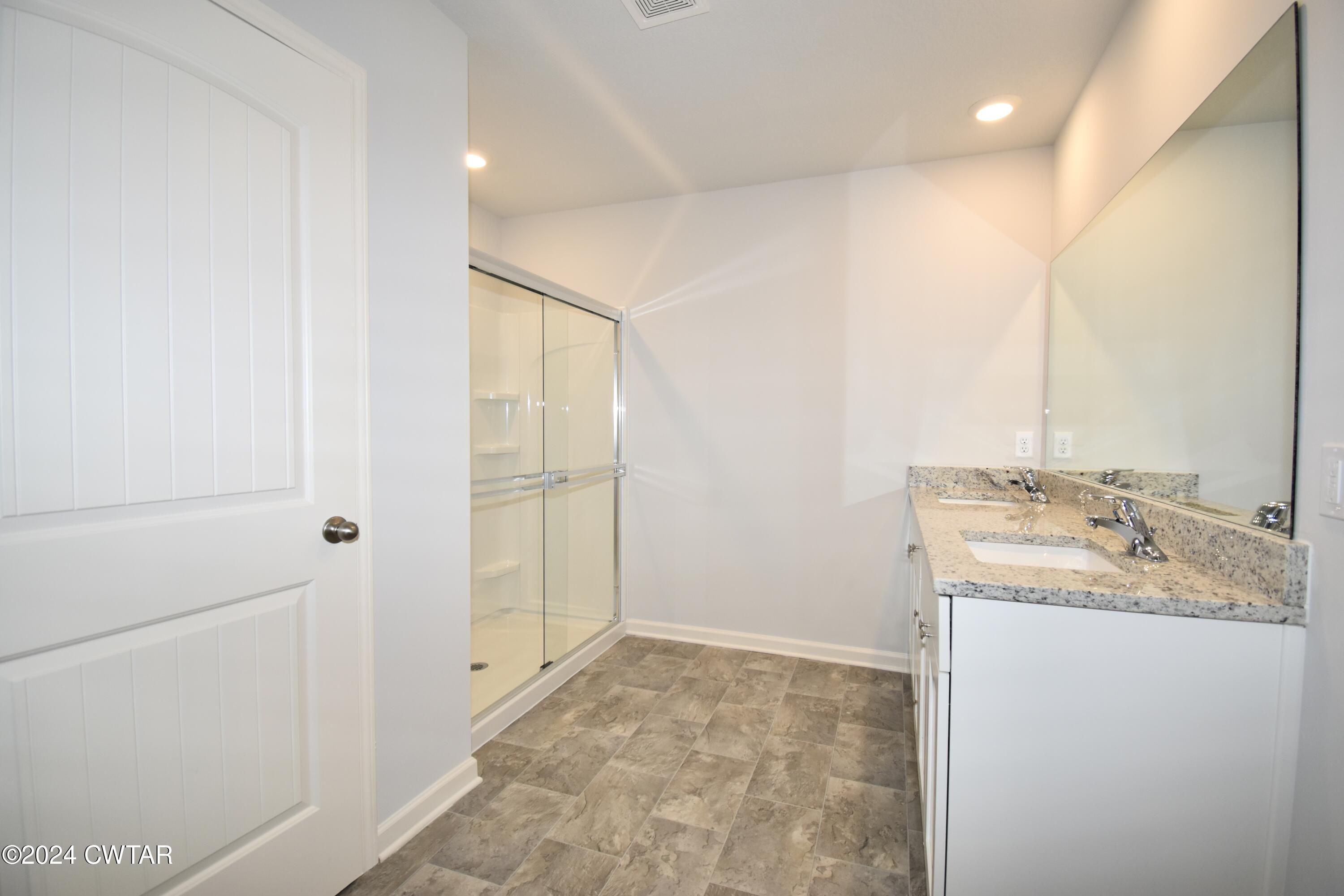 48 Vintage Grove Road Jackson, TN 38305 - Photo 11 of 19 a bathroom with a sink and a mirror
