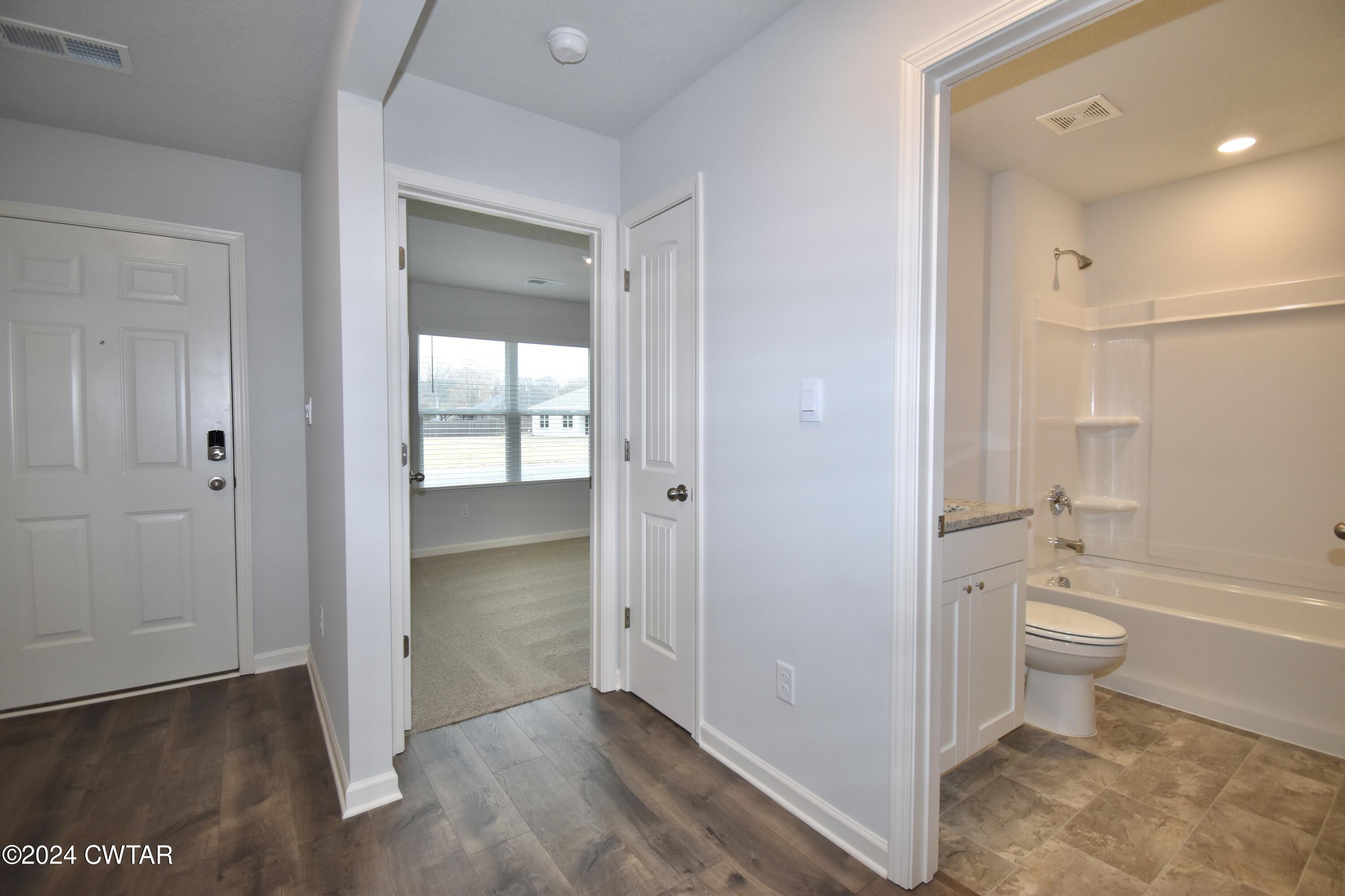 48 Vintage Grove Road Jackson, TN 38305 - Photo 13 of 19 a bathroom with a toilet sink and shower