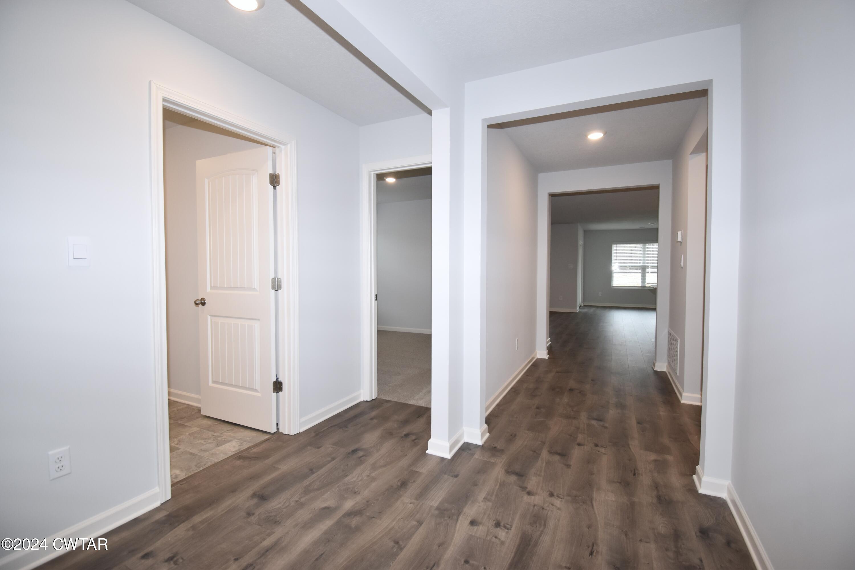 48 Vintage Grove Road Jackson, TN 38305 - Photo 17 of 19 wooden floor with a mirror