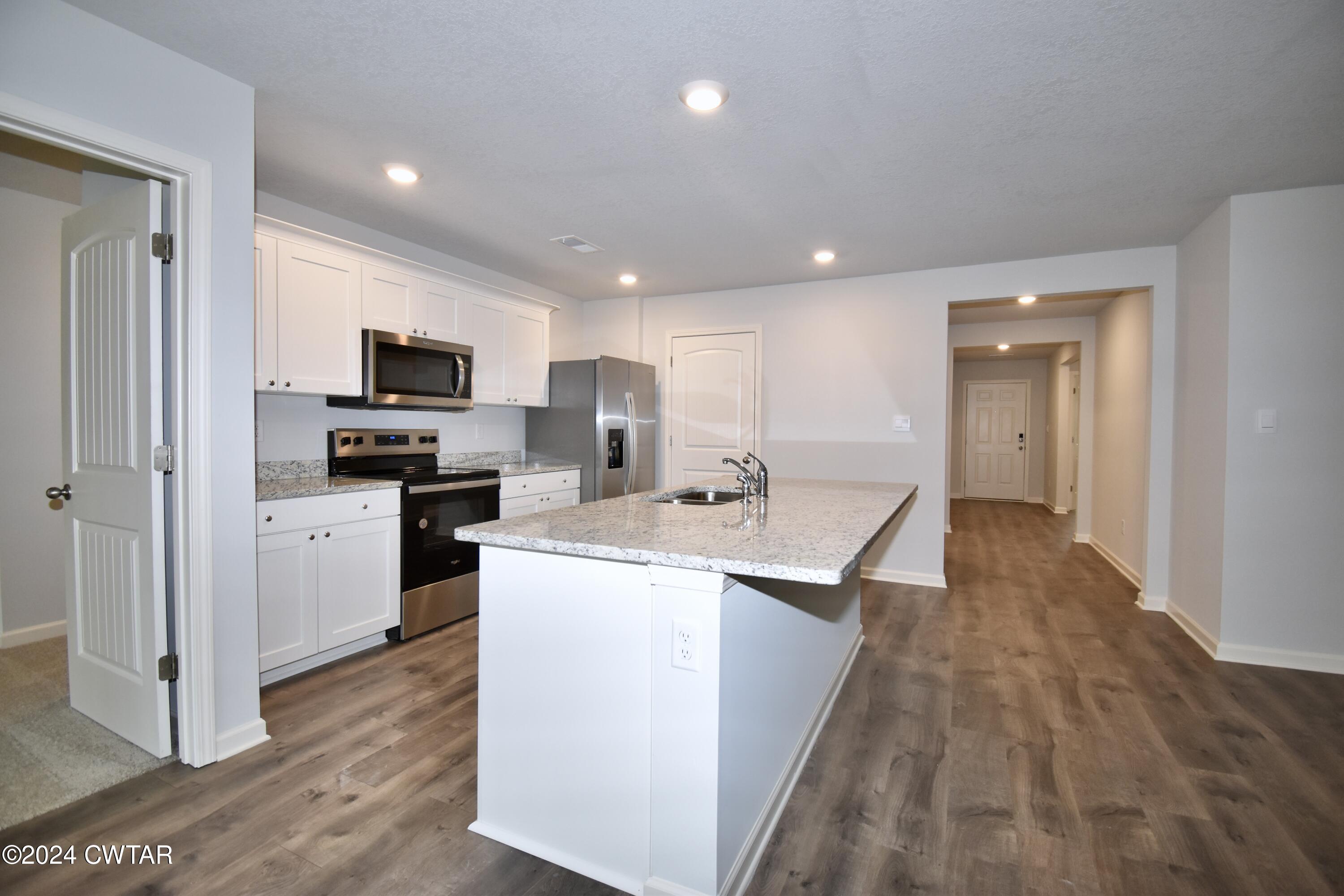 48 Vintage Grove Road Jackson, TN 38305 - Photo 5 of 19 a view of kitchen with sink microwave and refrigerator