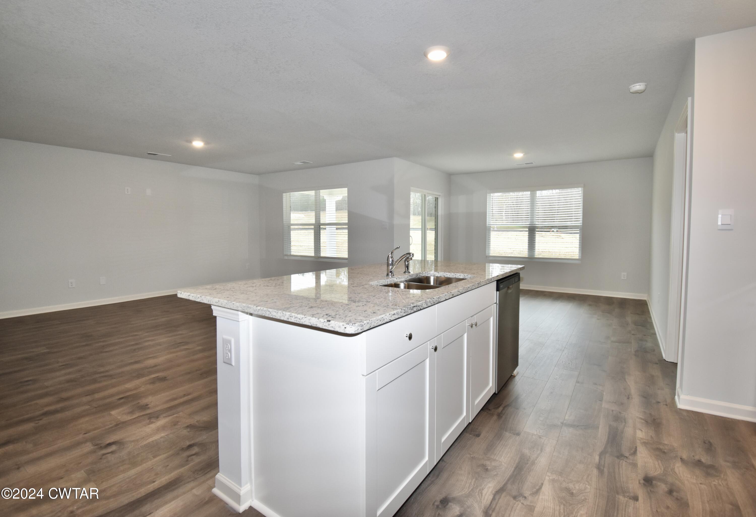 48 Vintage Grove Road Jackson, TN 38305 - Photo 7 of 19 a kitchen with granite countertop a sink and cabinets