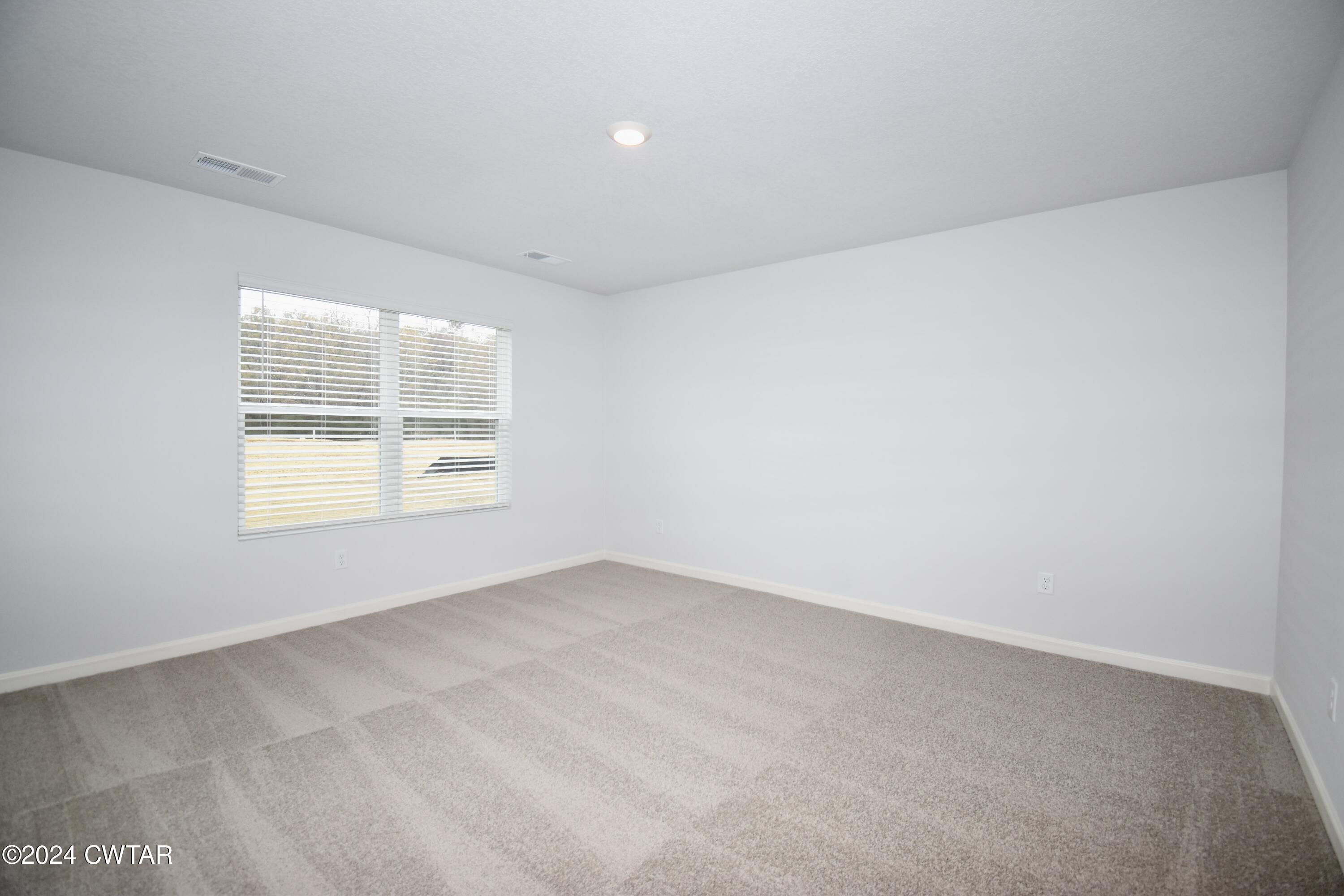 48 Vintage Grove Road Jackson, TN 38305 - Photo 10 of 19 an empty room with windows