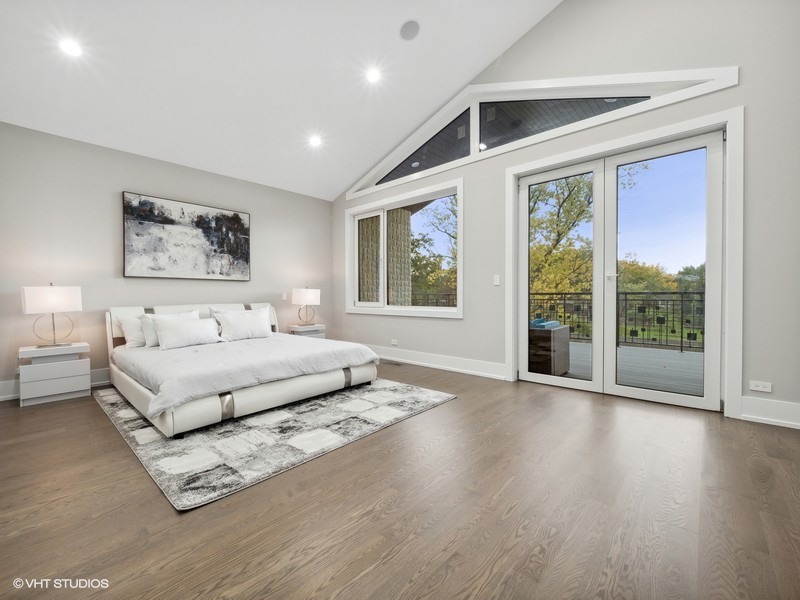 1341 Pfingsten Road Northbrook, IL 60062 - Photo 20 of 58 a spacious bedroom with a large bed and a large window