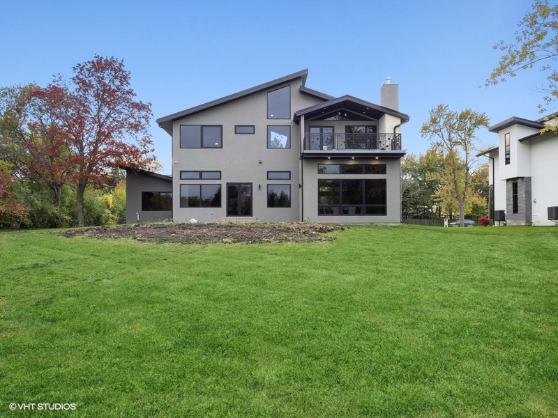 1341 Pfingsten Road Northbrook, IL 60062 - Photo 30 of 58 a front view of a house with a garden and trees
