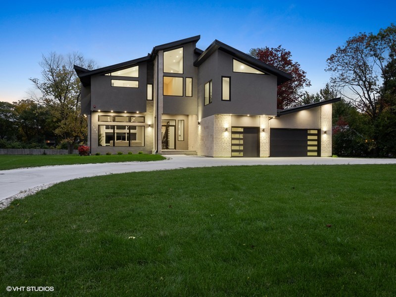 1341 Pfingsten Road Northbrook, IL 60062 - Photo 6 of 58 a front view of a house with a yard and trees