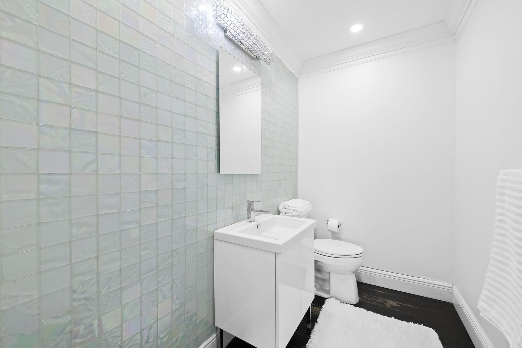 456 East Boca Raton Road Boca Raton, FL 33432 - Photo 21 of 33 a bathroom with a sink and toilet