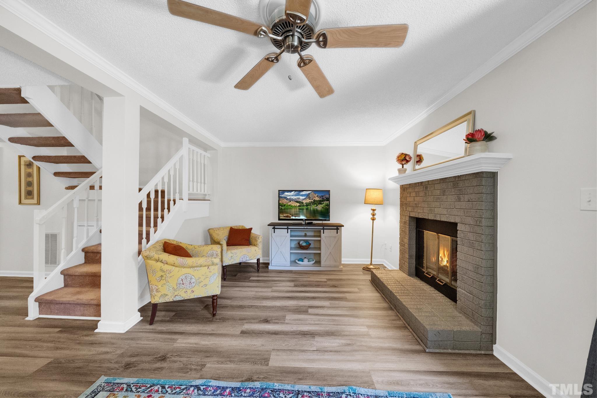 4650 Pine Trace Drive Raleigh, NC 27613 - Photo 11 of 26 a living room with furniture and a fireplace