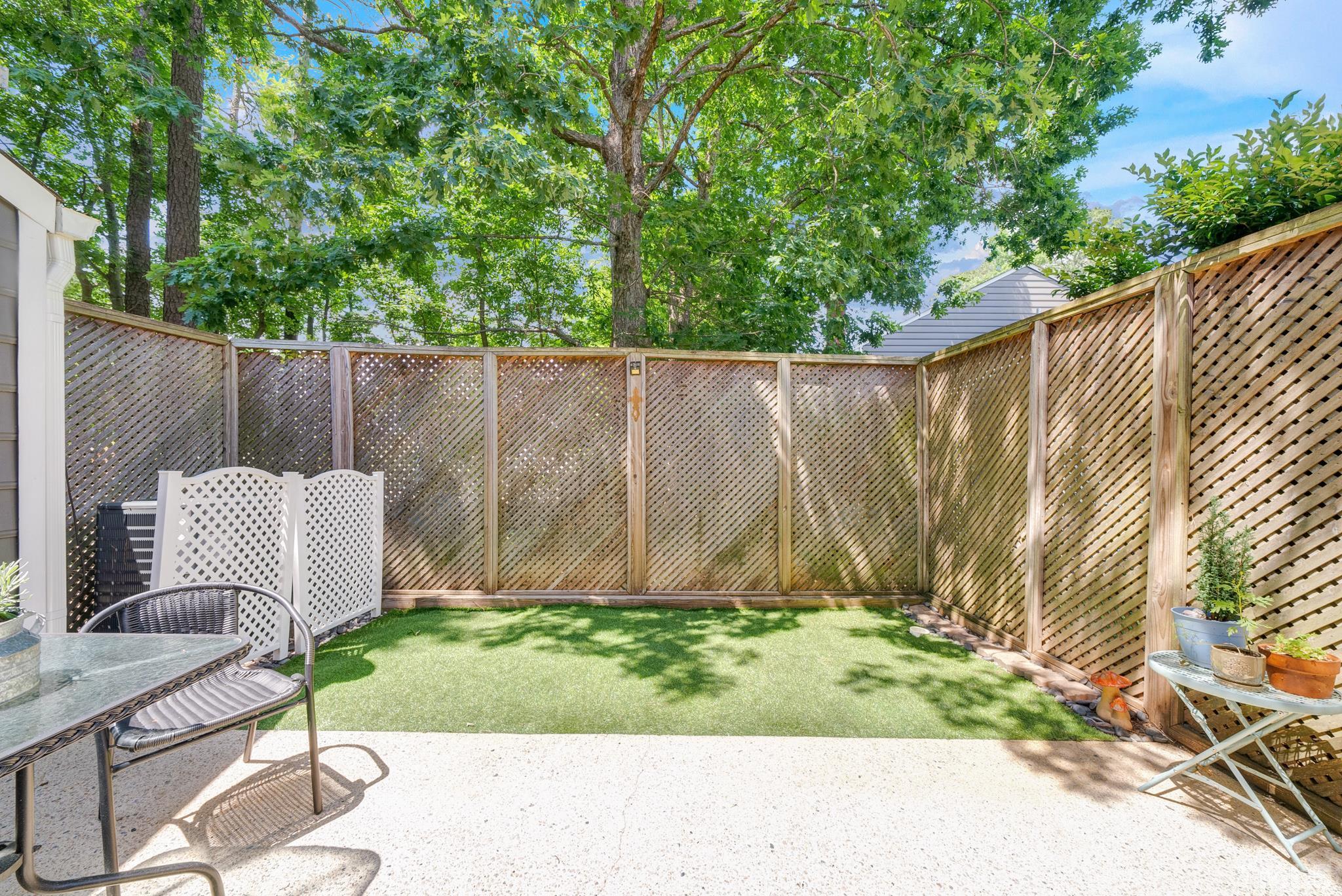 4650 Pine Trace Drive Raleigh, NC 27613 - Photo 22 of 26 a view of a chair and table in the backyard