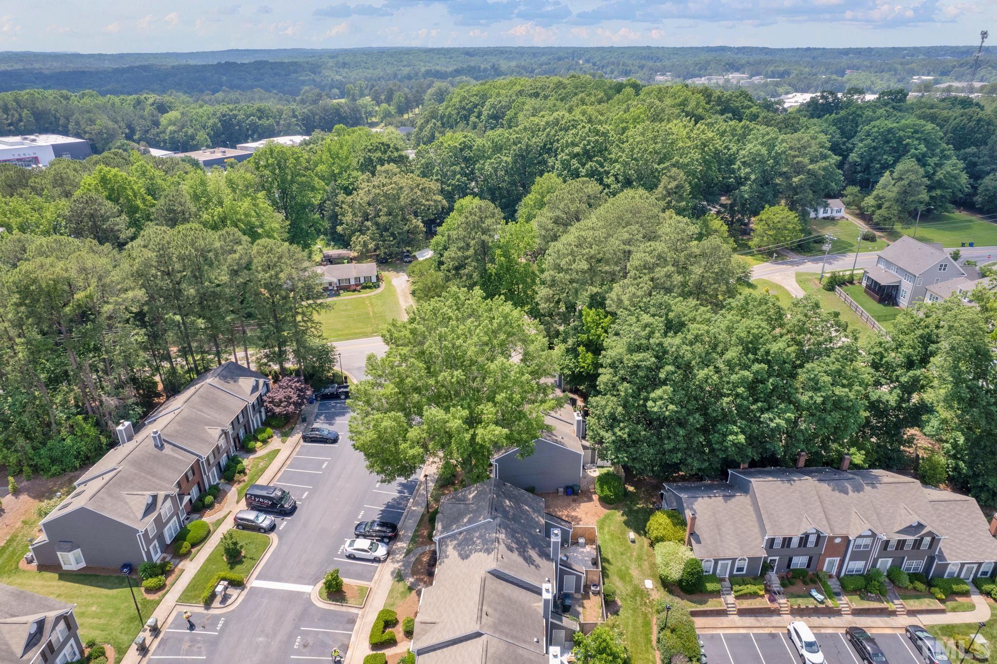 4650 Pine Trace Drive Raleigh, NC 27613 - Photo 25 of 26 an aerial view of residential houses with outdoor space and street view