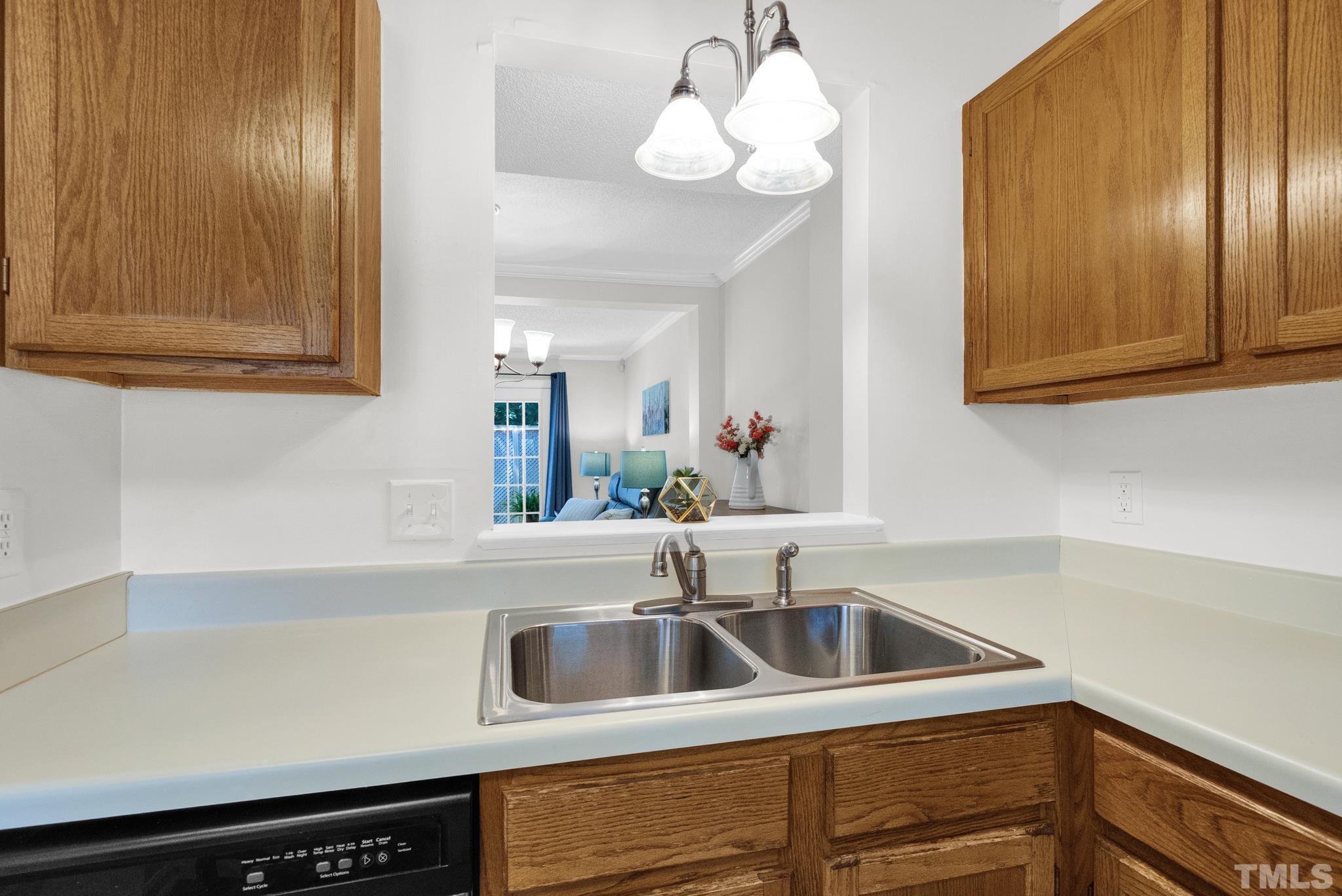 4650 Pine Trace Drive Raleigh, NC 27613 - Photo 6 of 26 a kitchen with a sink and cabinets