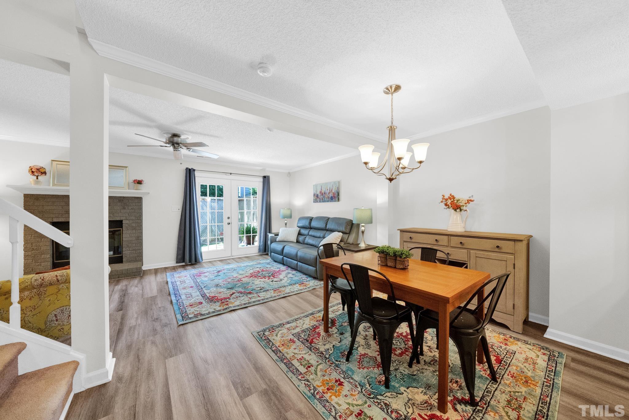 4650 Pine Trace Drive Raleigh, NC 27613 - Photo 8 of 26 a view of a dining room with furniture and wooden floor