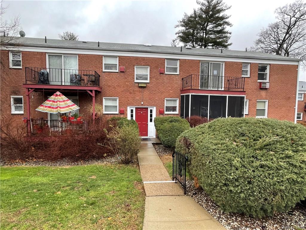 9 Milford Lane, Unit 7107 Suffern, NY 10901 - Photo 1 of 11 front view of house with a yard