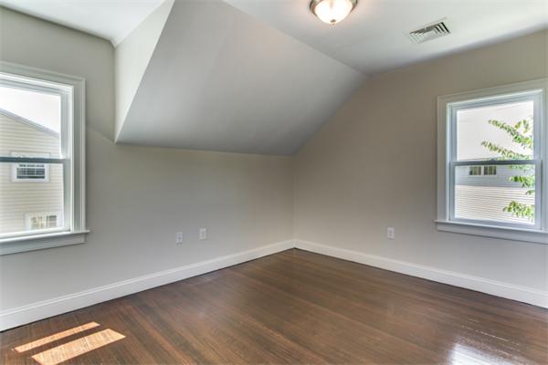 57 Creeley Road Belmont, MA 02478 - Photo 11 of 13 an empty room with wooden floor and windows
