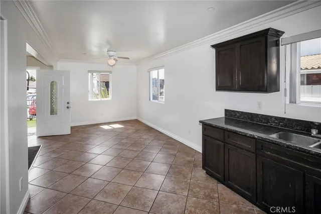 a kitchen with granite countertop a stove and a cabinets