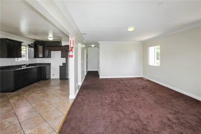 a view of a kitchen with a sink and cabinets