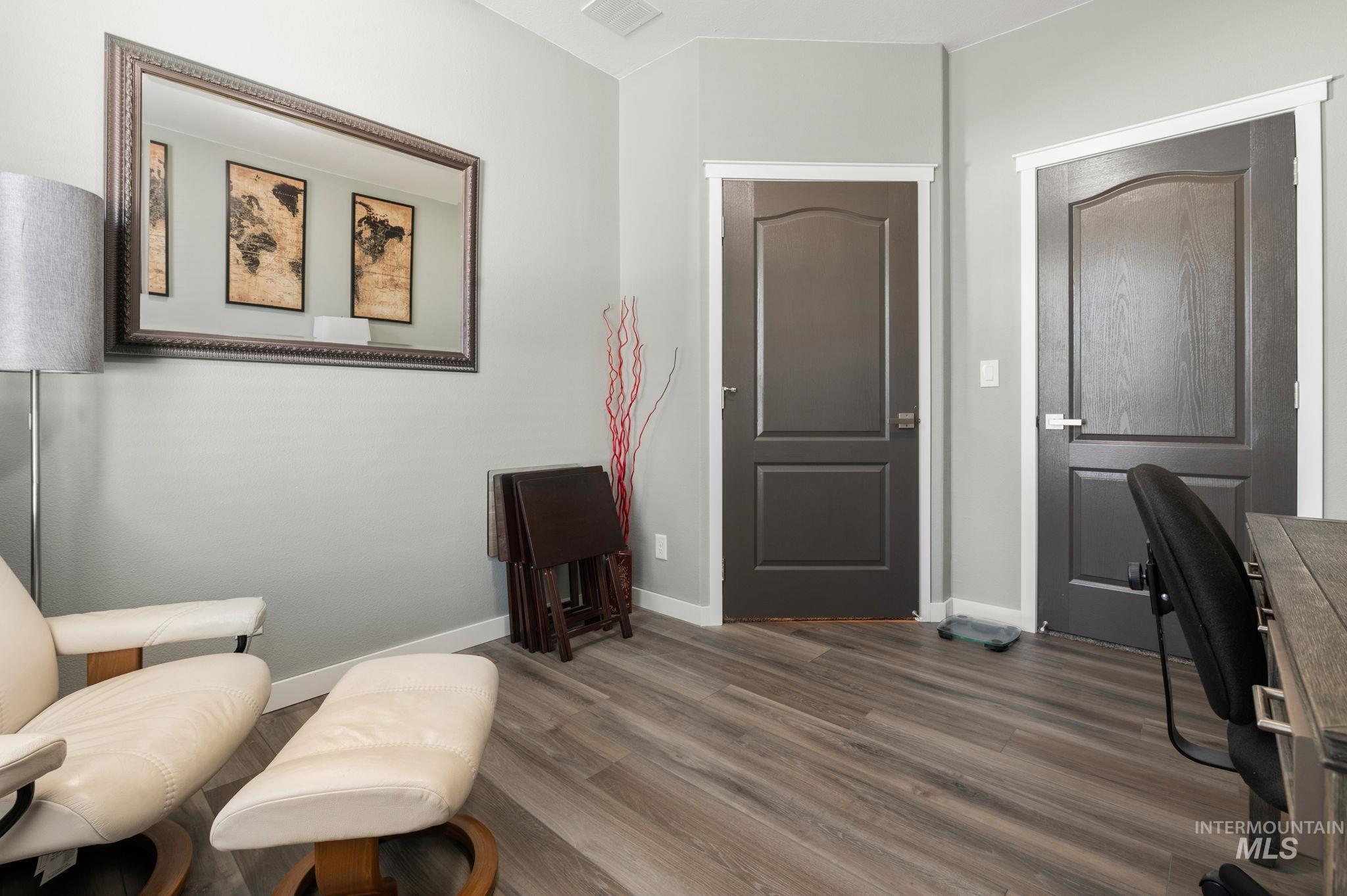 837 Burrell Avenue Lewiston, ID 83501 - Photo 15 of 32 Living area featuring wood finished floors and baseboards