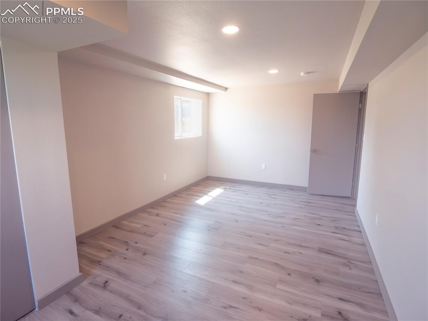 4130 Walker Road Colorado Springs, CO 80908 - Photo 17 of 39 Spare room featuring light wood-style flooring and recessed lighting