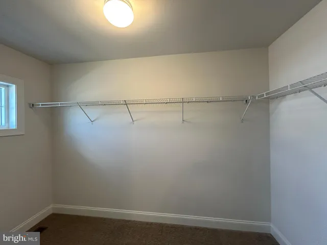 a view of a room with racks on the wall