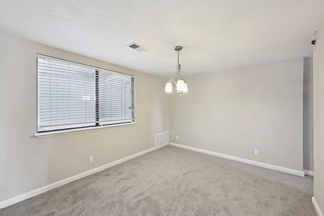 a view of empty room with windows