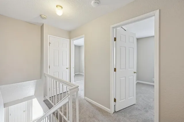 a view of a hallway with closet