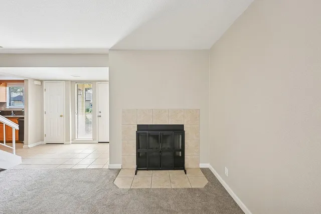 wooden floor in an empty room with a fireplace