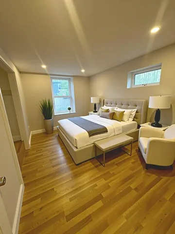 a bedroom with a bed and a couch