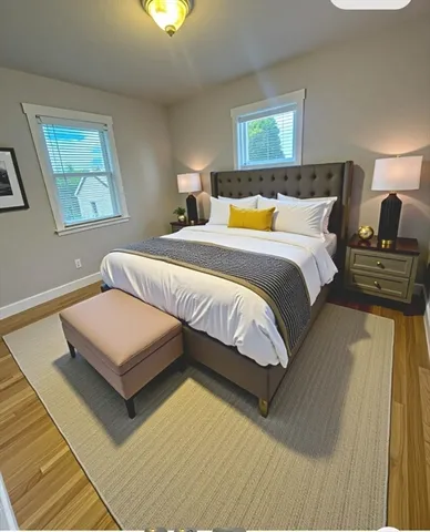 a bedroom with a bed and a night stand