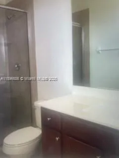 a bathroom with a toilet and a sink