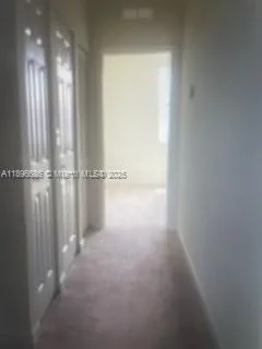 a view of a room with an empty space