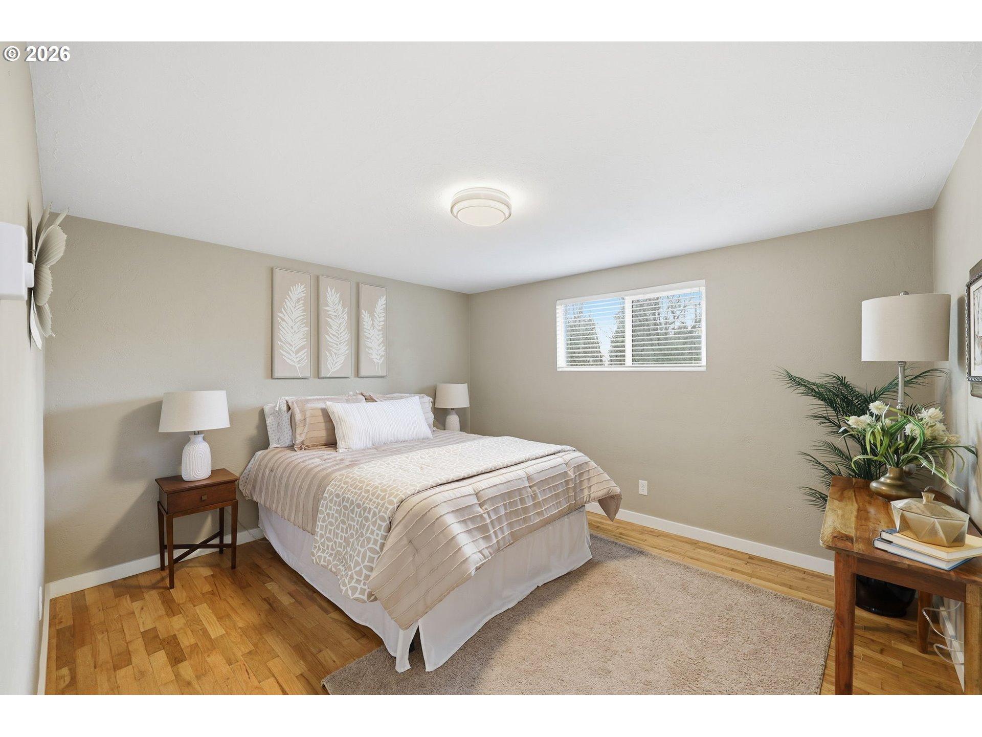 381 Marion Lane Eugene, OR 97404 - Photo 14 of 39 a bedroom with a bed table chair and a window