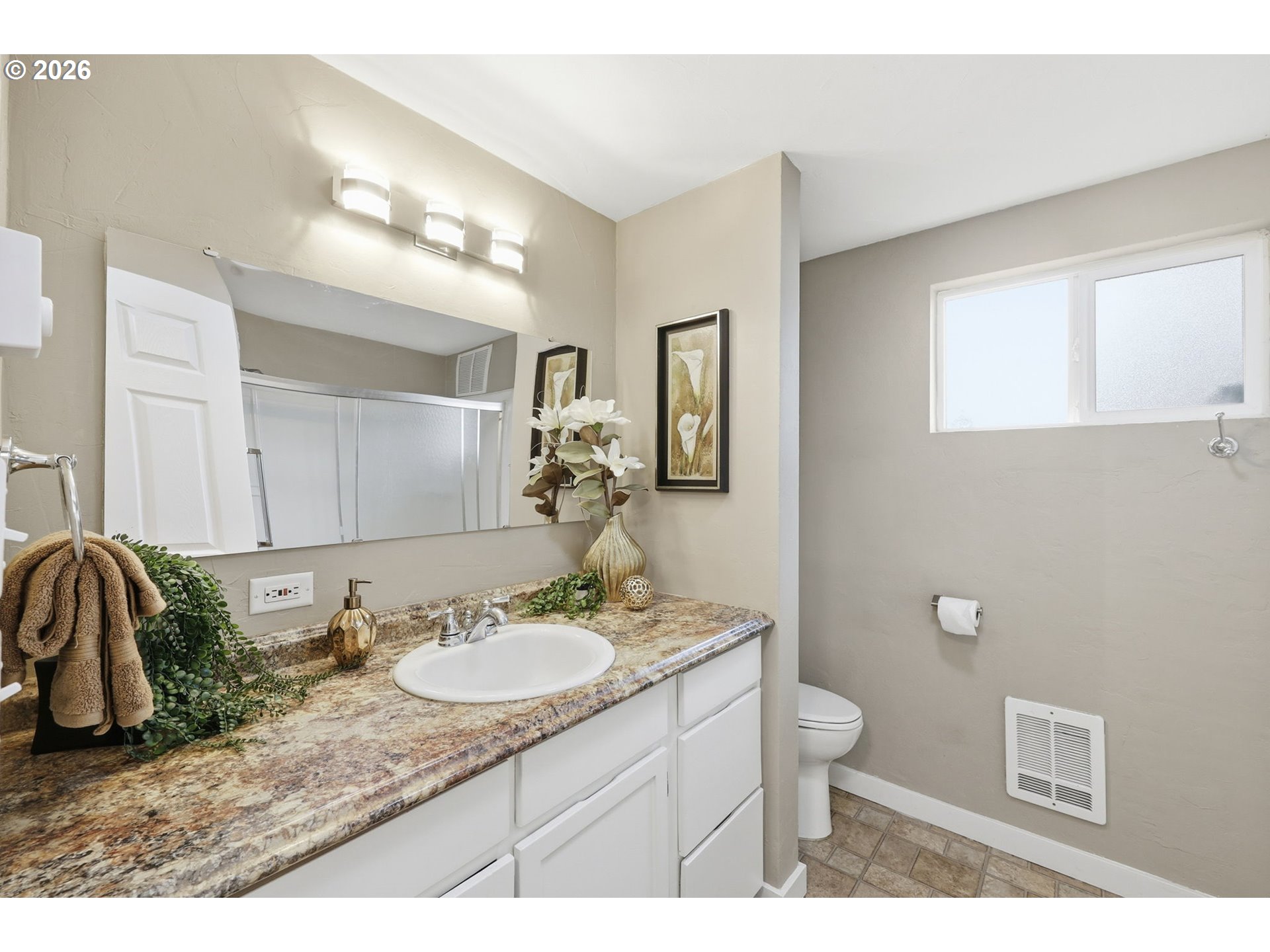 381 Marion Lane Eugene, OR 97404 - Photo 15 of 39 a bathroom with a granite countertop sink a toilet and a mirror