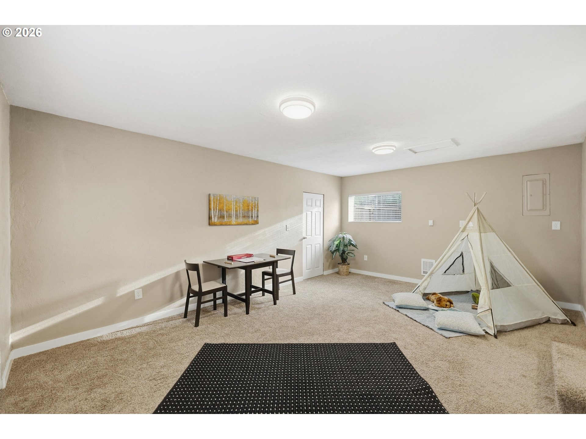 381 Marion Lane Eugene, OR 97404 - Photo 23 of 39 a living room with a dining table furniture and a wooden floor