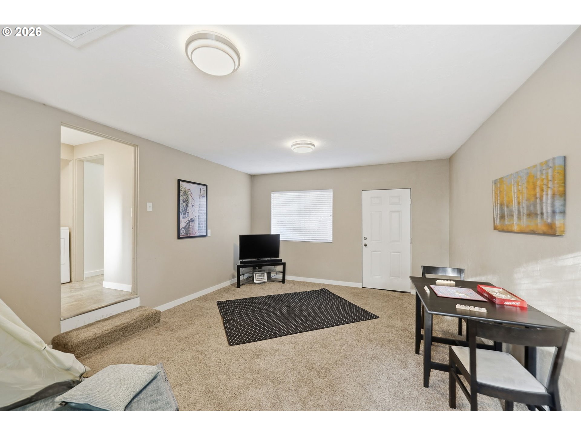381 Marion Lane Eugene, OR 97404 - Photo 24 of 39 a living room with furniture a dining table and a window