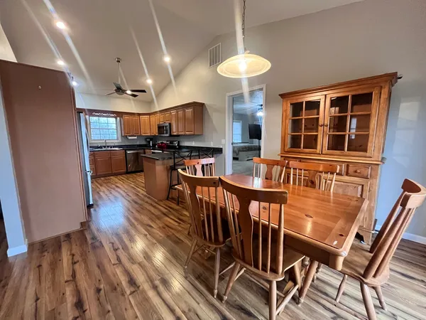 a view of a kitchen and dining room
